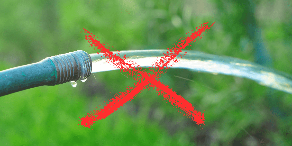 A water hose with a red x on it